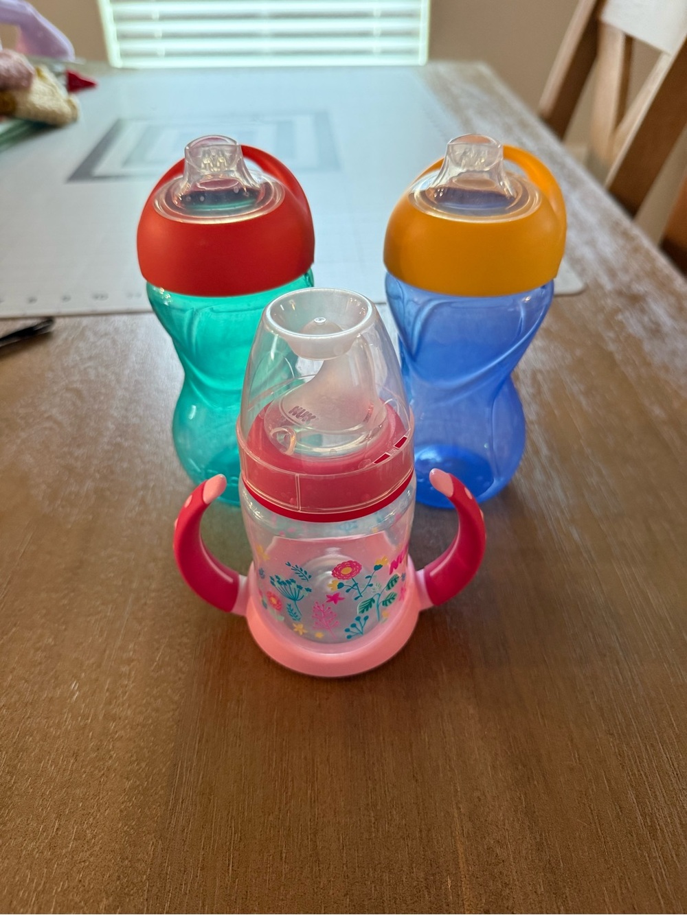 Set of 3 Colorful Nuk & Nuby Toddler Sippy Cups - Pink, Teal & Blue Gently Used